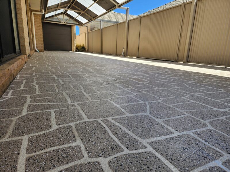 Concrete stenciling specialists working on a Perth alfresco