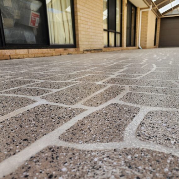 Concrete stenciling specialists working on a Perth alfresco