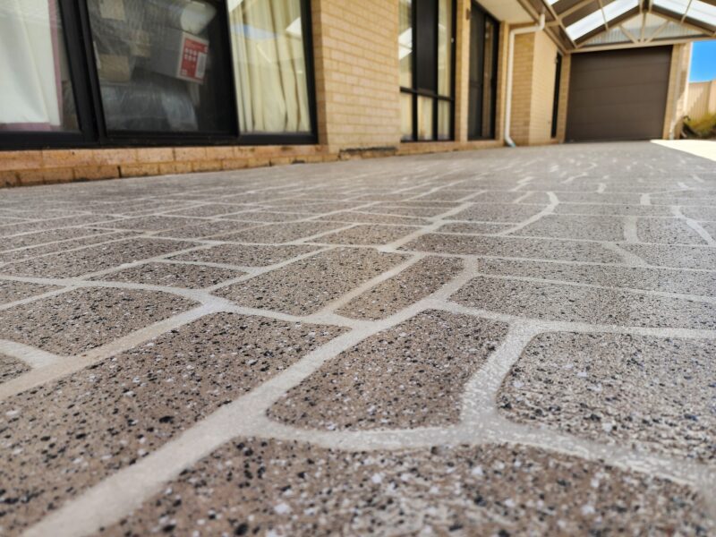 Concrete stenciling specialists working on a Perth alfresco